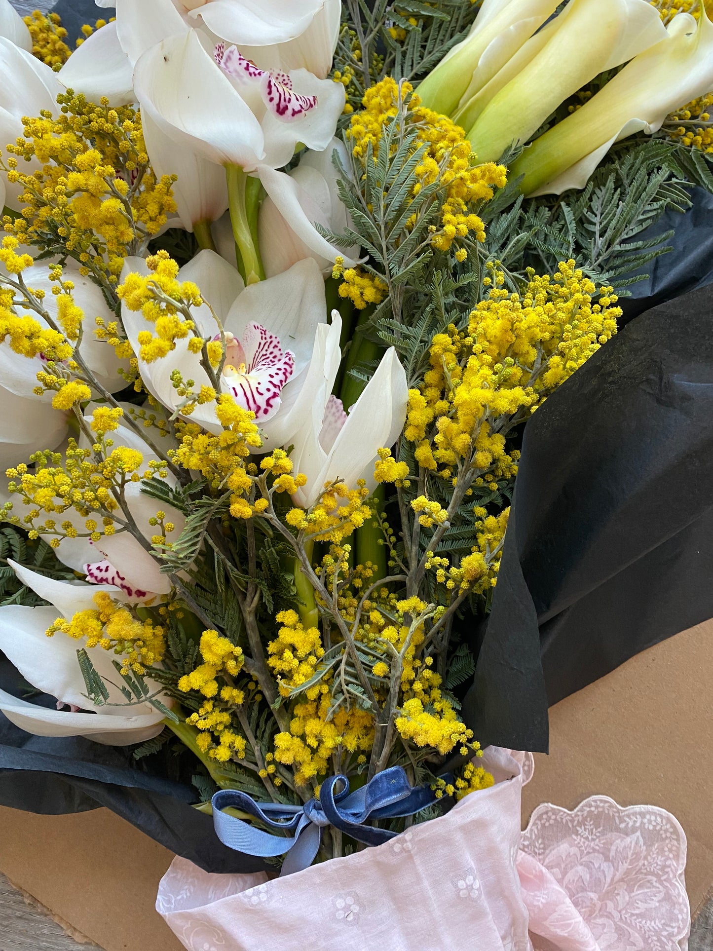 Cymbidiums and callas- fresh cut floral bouquet