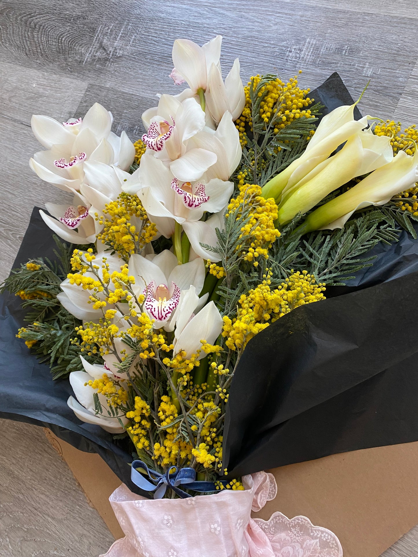 Cymbidiums and callas- fresh cut floral bouquet