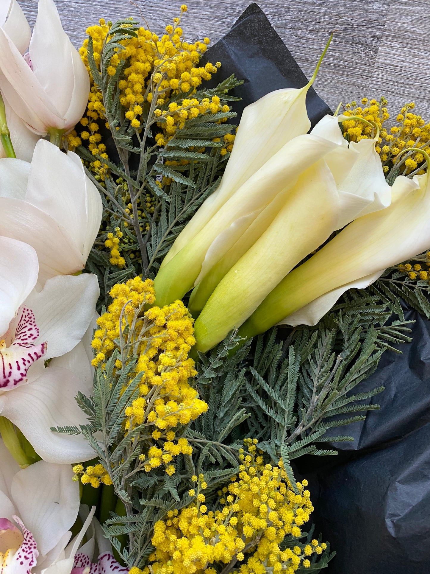 Cymbidiums and callas- fresh cut floral bouquet